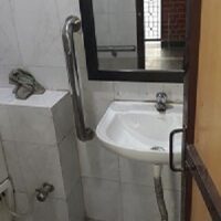 Accessible toilets with side rails